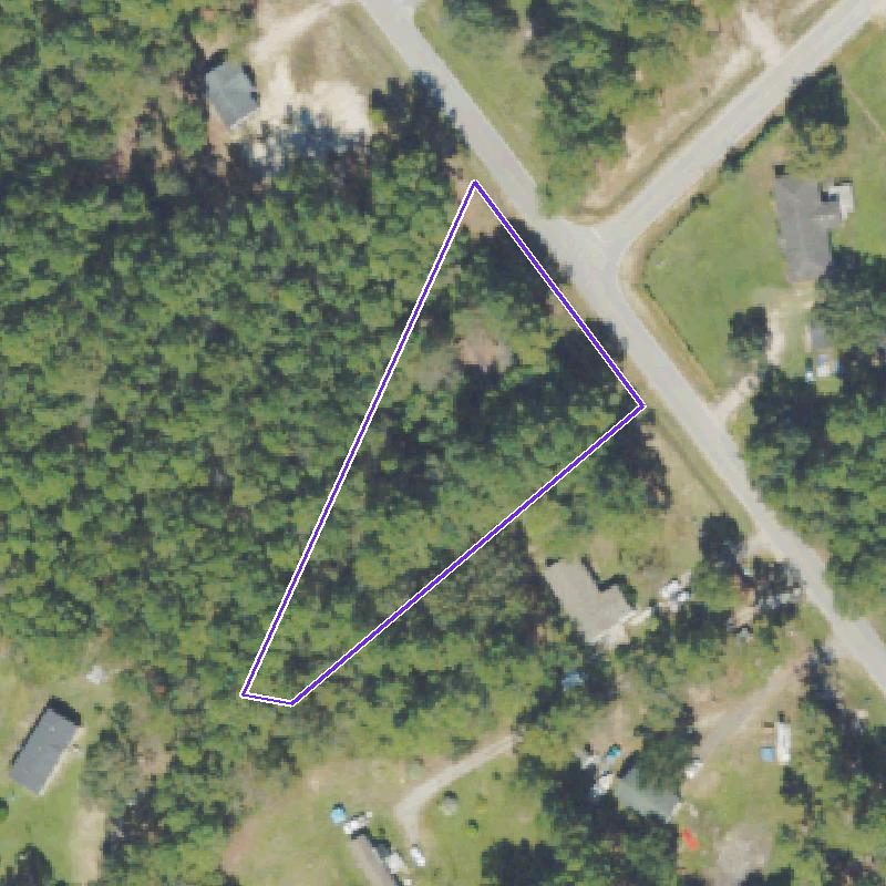 Overhead aerial of the one-acre lot outlined in white, wooded, on a curve of Cook Road.