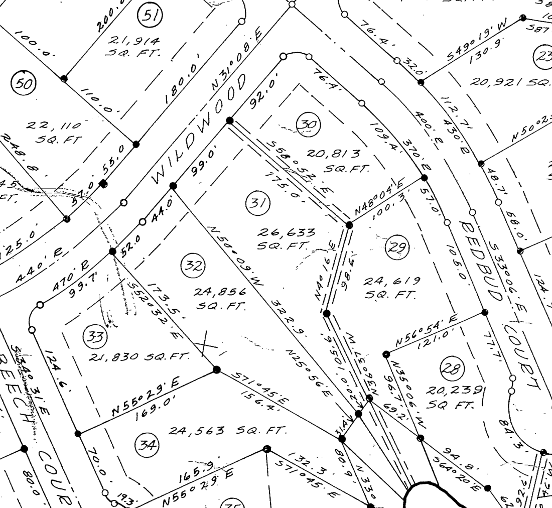 Section of the 1966 subdivision plat showing Lots 31 and 32 on Wildwood Drive, 26,633 and 24,856 square feet.