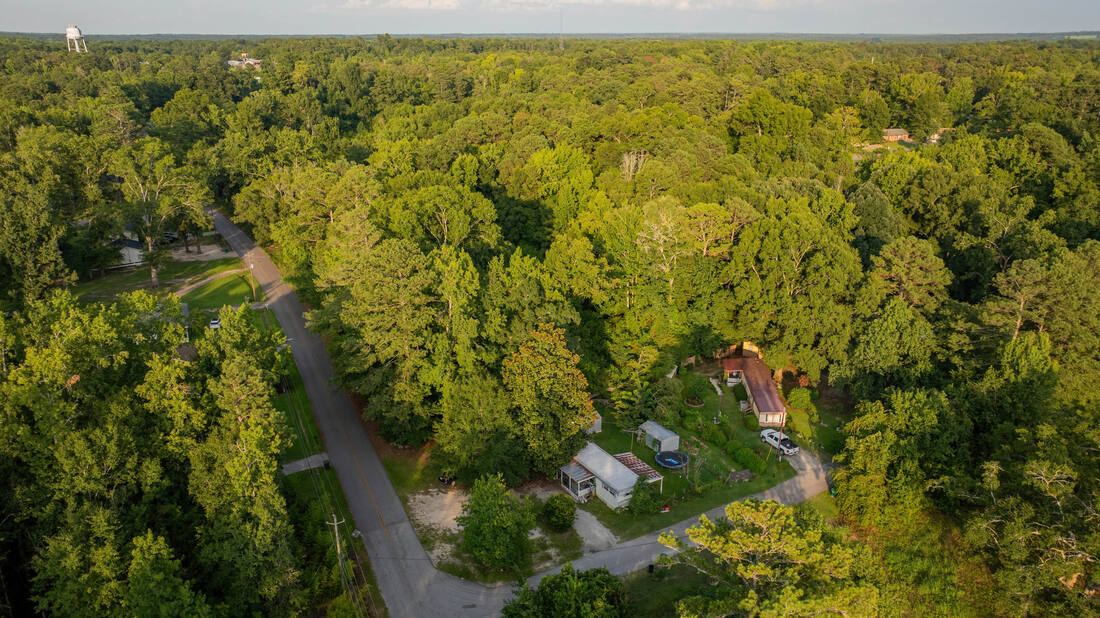 Aerial showing existing single-family homes on lots adjoining the property.